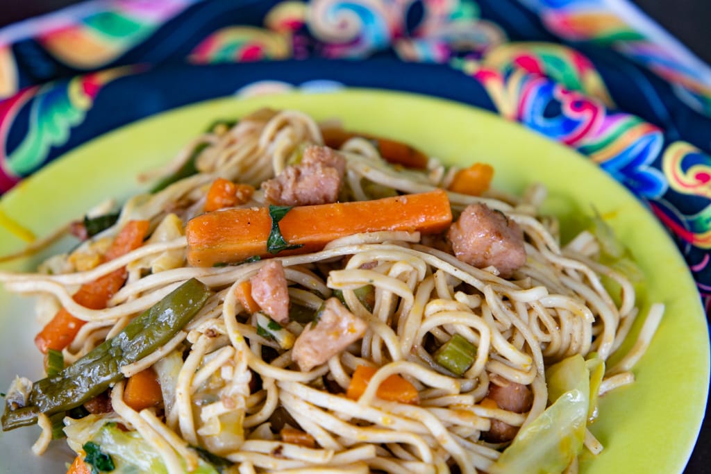 close up overhead image of chop suey in a green bowl