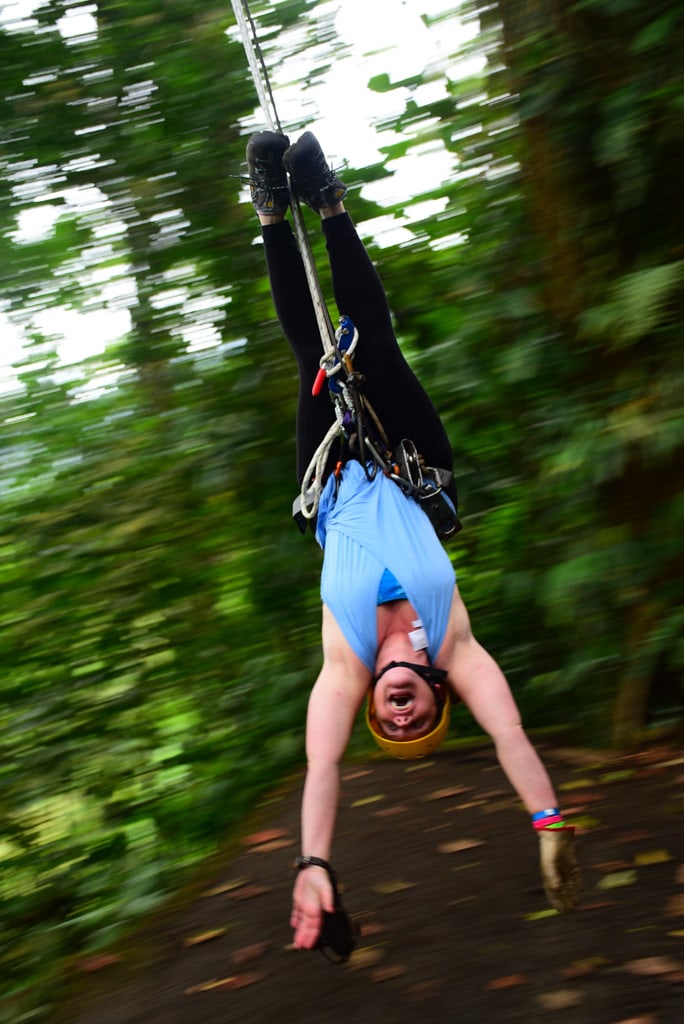 woman hanging from zipping