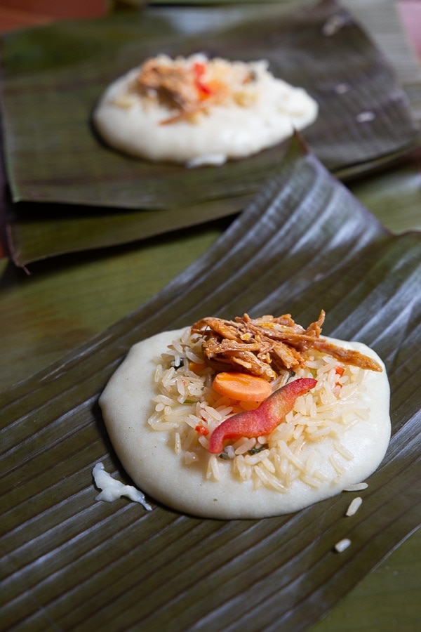tamale masa i Costa Rica with arroz arregaldo, shredded porl, red bell pepper and carrots