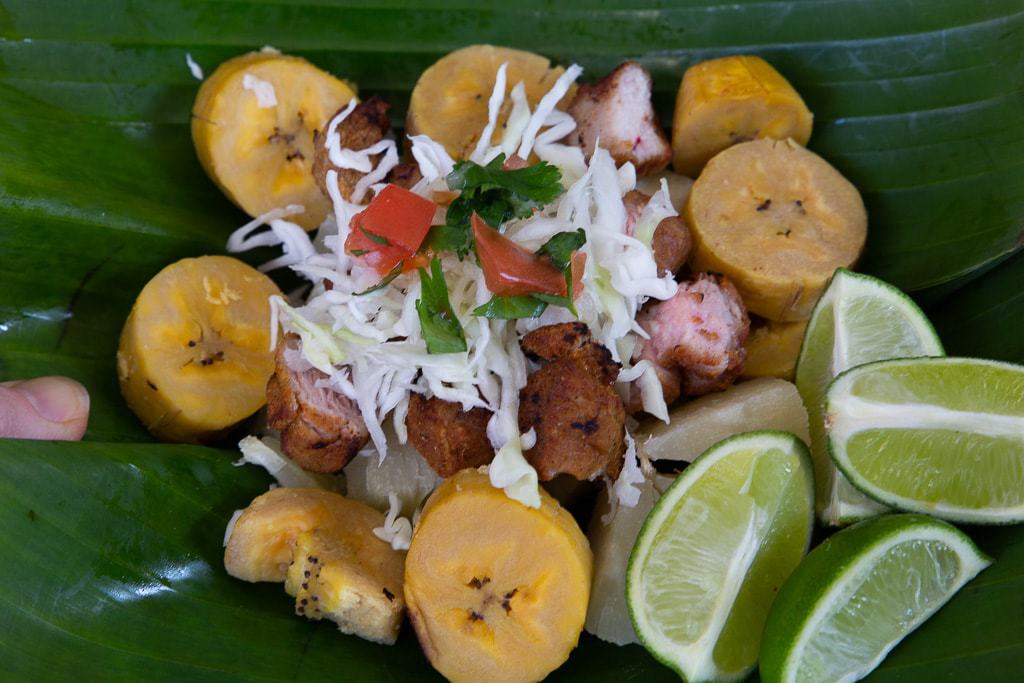 costa rican salad with lime, chicharron, chimichurri sauce and yuca