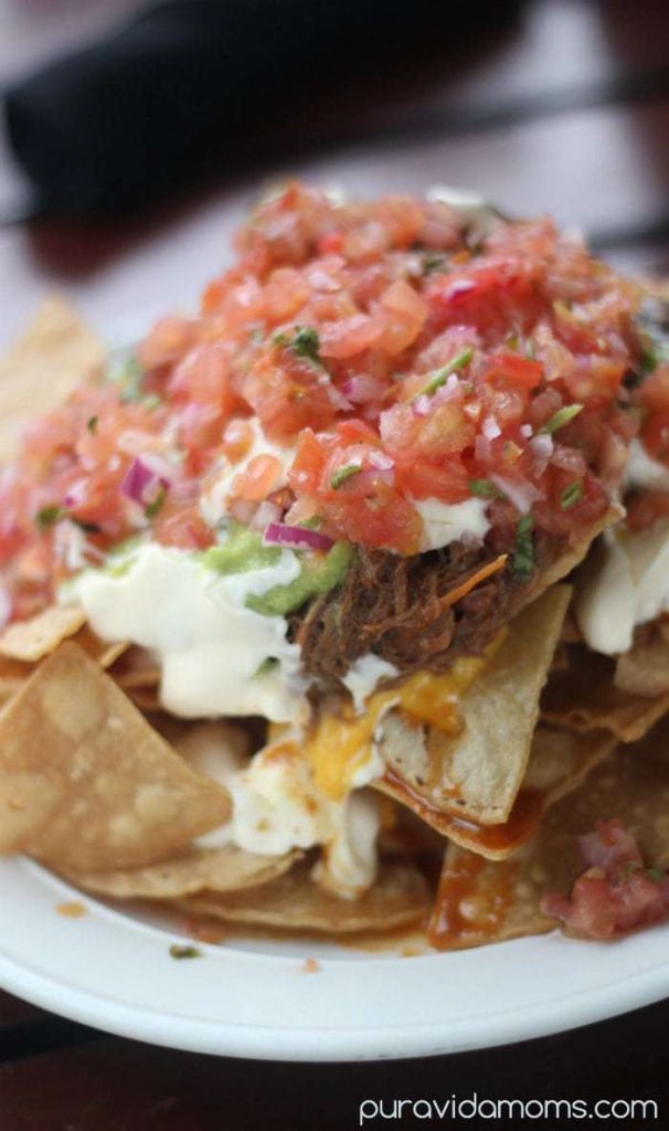 Nachos loaded with shredded beef, pico de gallo, sour cream, and guacamole.