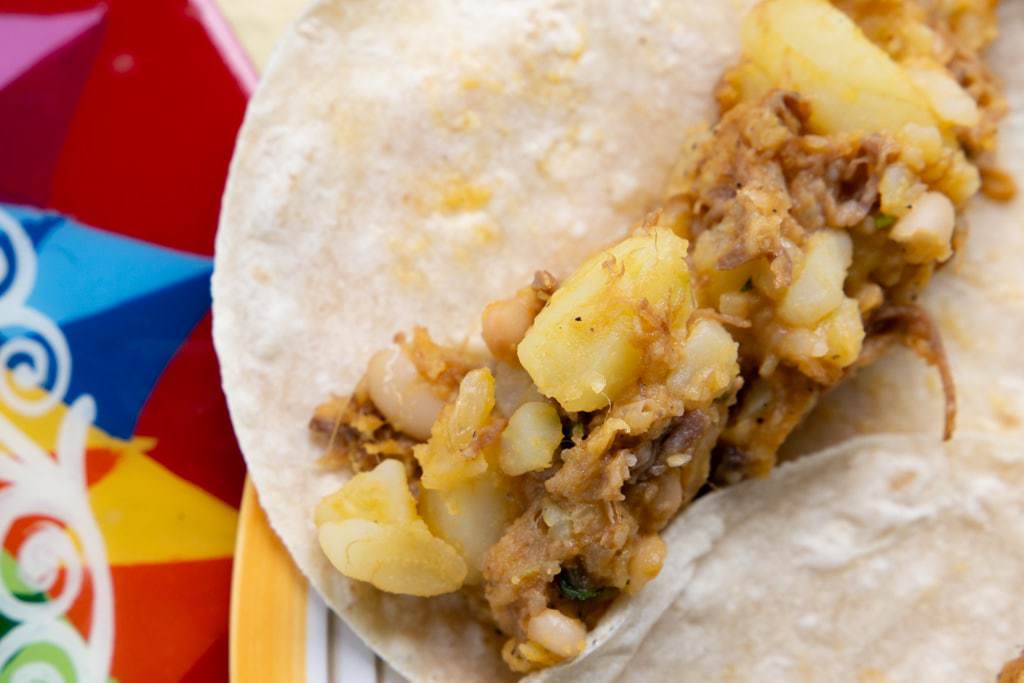 Tortilla with a serving of potato hash in its center.